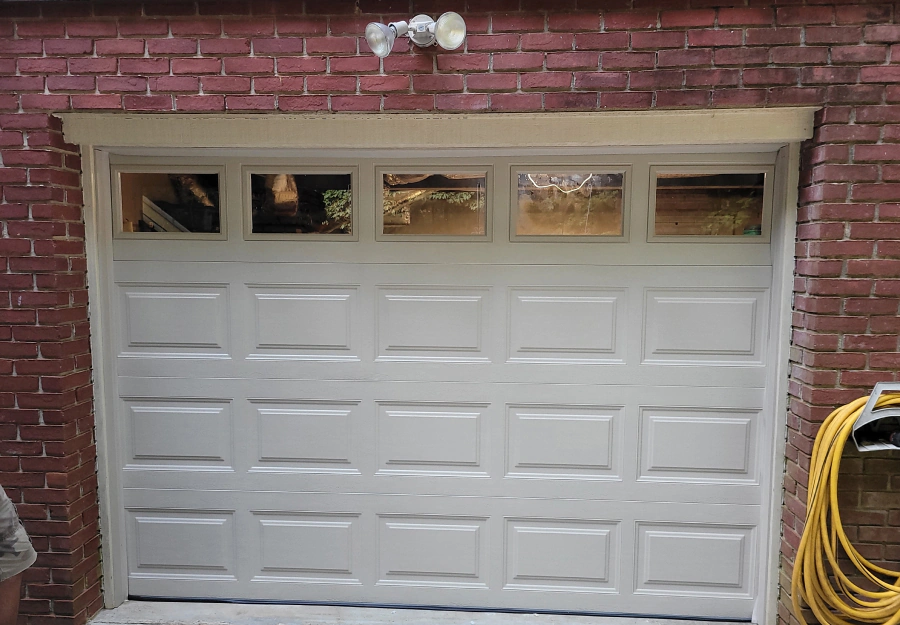 newly installed white garage door in a home